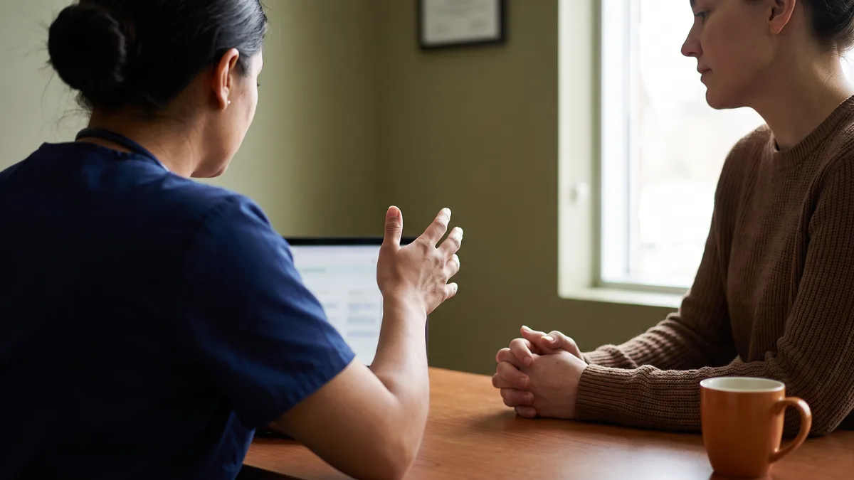 Healthcare professional explaining A1C levels to a patient.